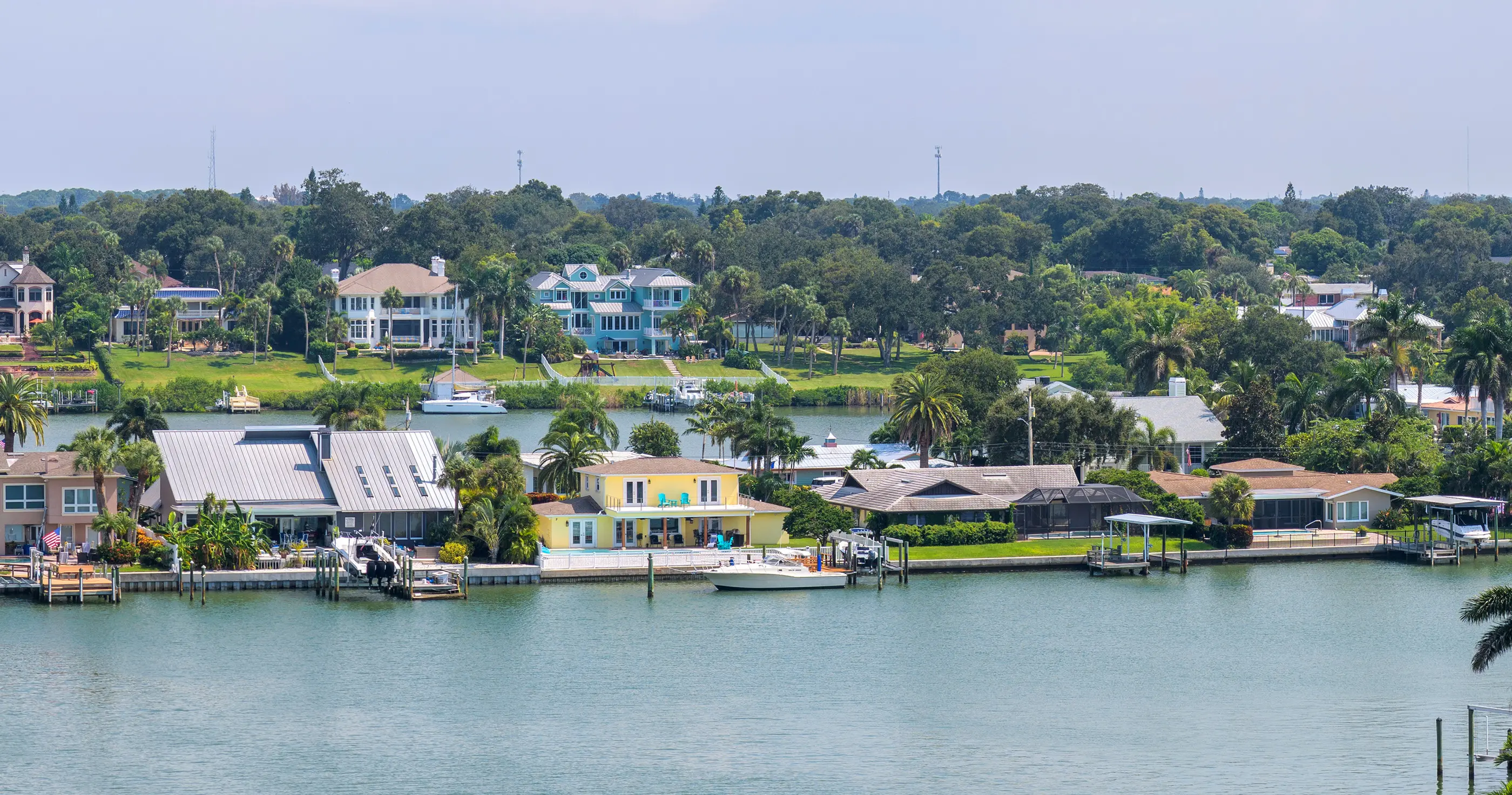 Homes, palms and boat docks lining a channel in Largo, Pinellas County, Florida