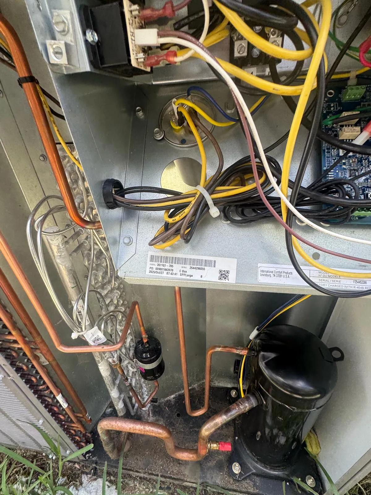 Inside the old unit before the changeout: compressor, copper lines and wiring
