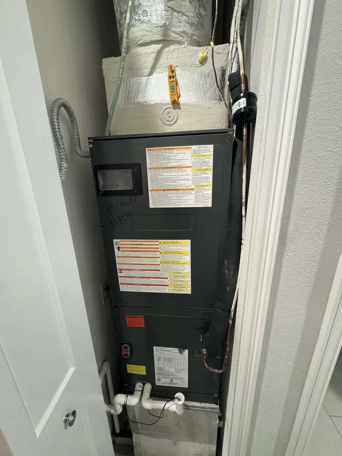 Air handler with insulated supply plenum and PVC condensate drain in a closet, Safety Harbor FL