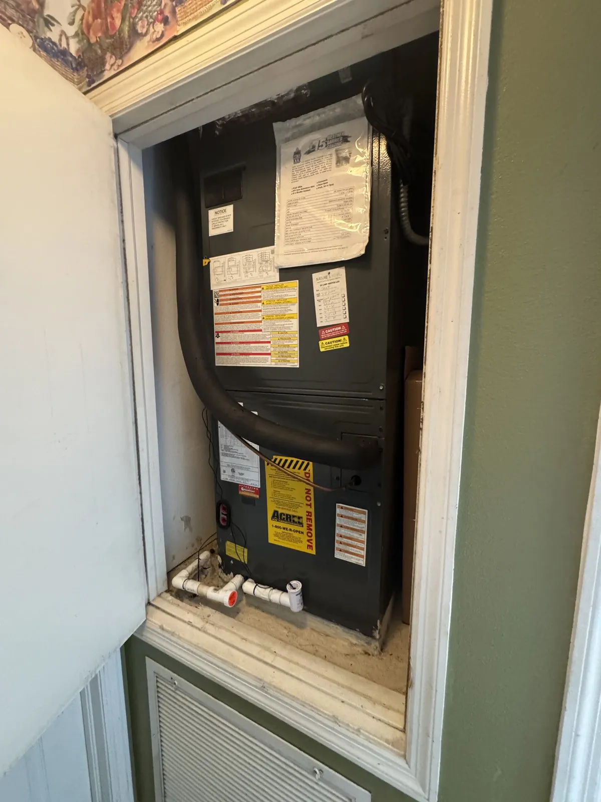 Closet air handler with PVC condensate drain line, Waters Ave, Tampa FL