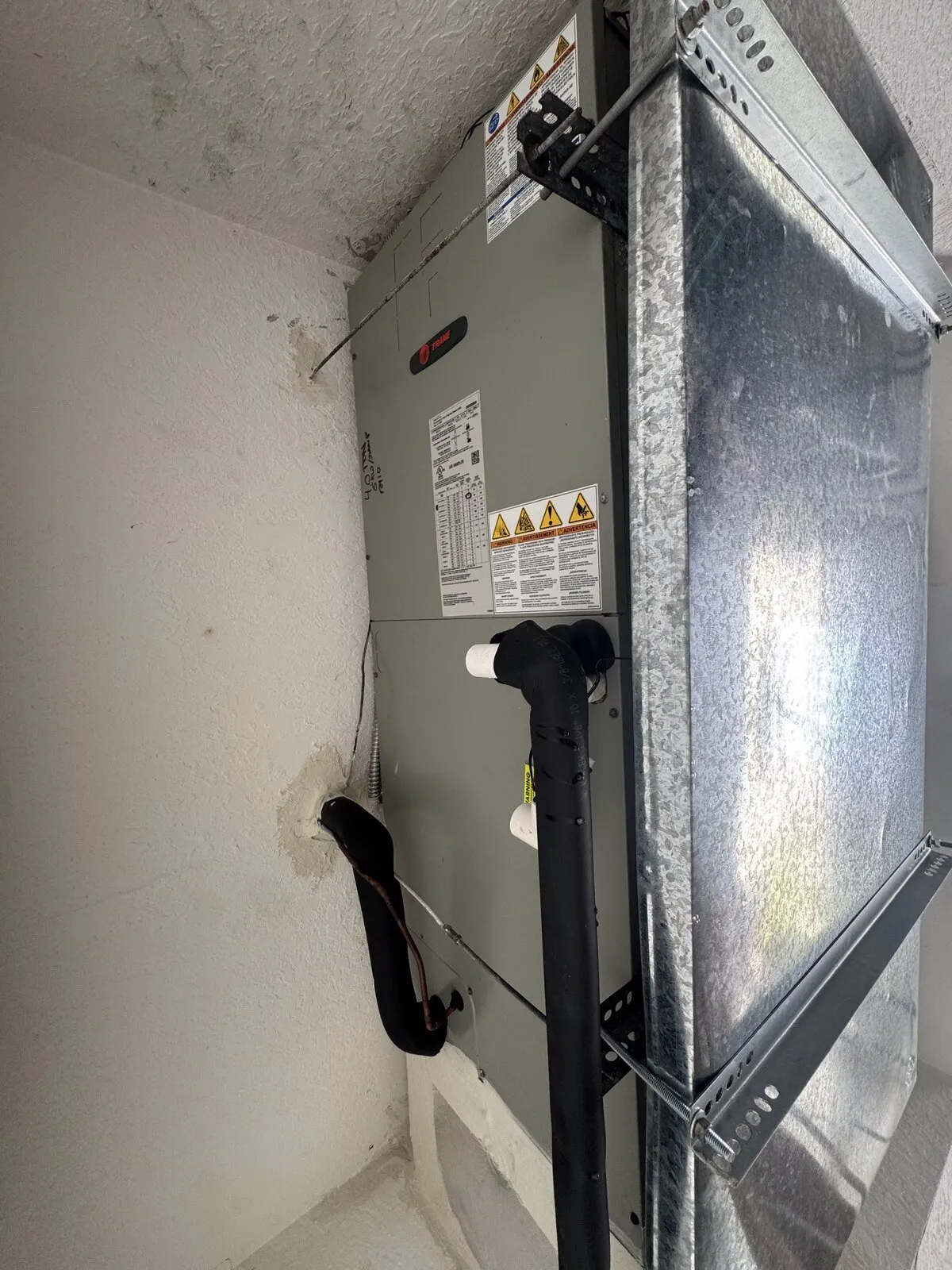 Trane air handler installed in a utility closet, Westchase, Tampa FL