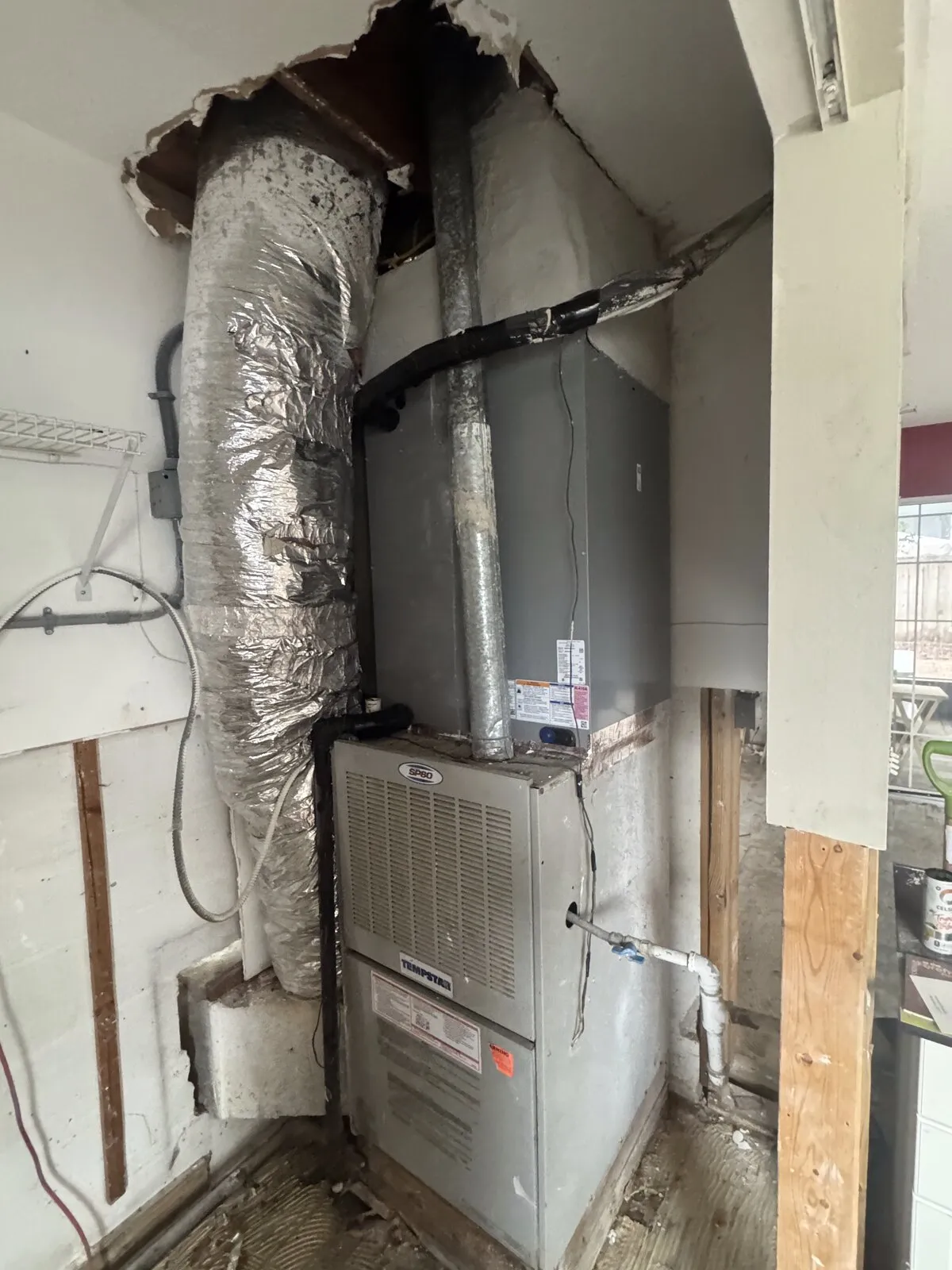 Flexible ducts connected to the supply plenum above an air handler, Westshore Blvd area, Tampa FL 33609