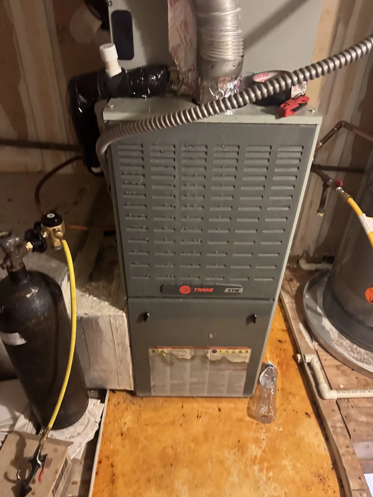Trane air handler with refrigerant gauges and tank connected in a utility closet, Westshore Blvd area, Tampa FL 33609