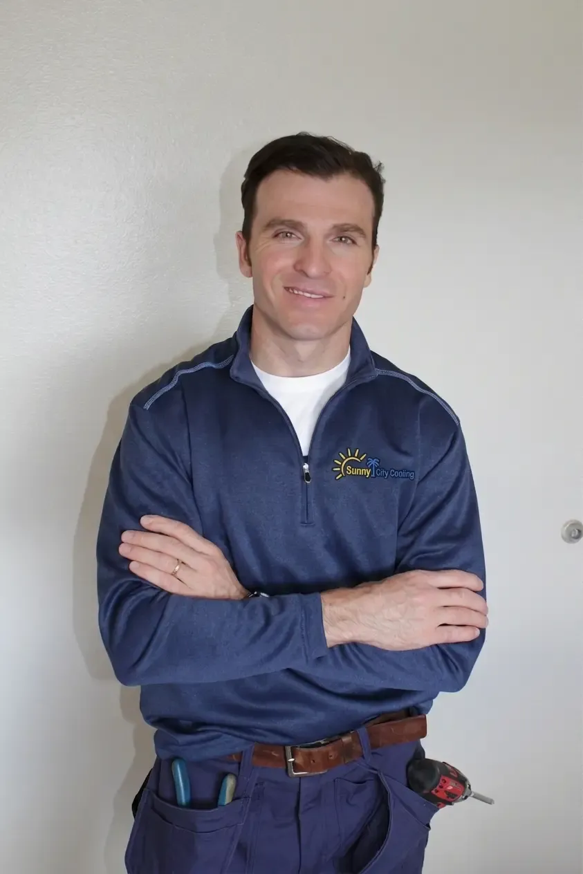 Sunny City Cooling technician in company uniform