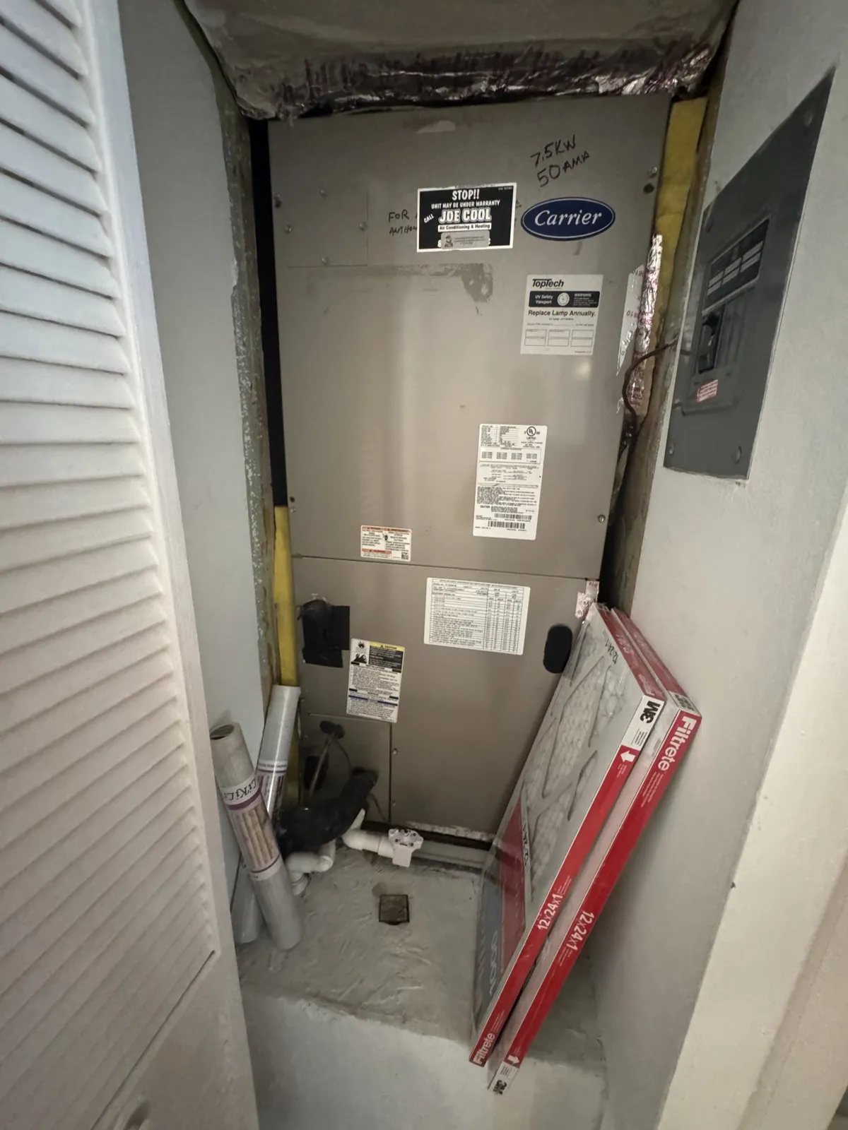 Carrier air handler in a closet with replacement air filters, Bloomingdale area, Valrico FL